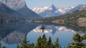 lake in front of mountain at yellowstone national park