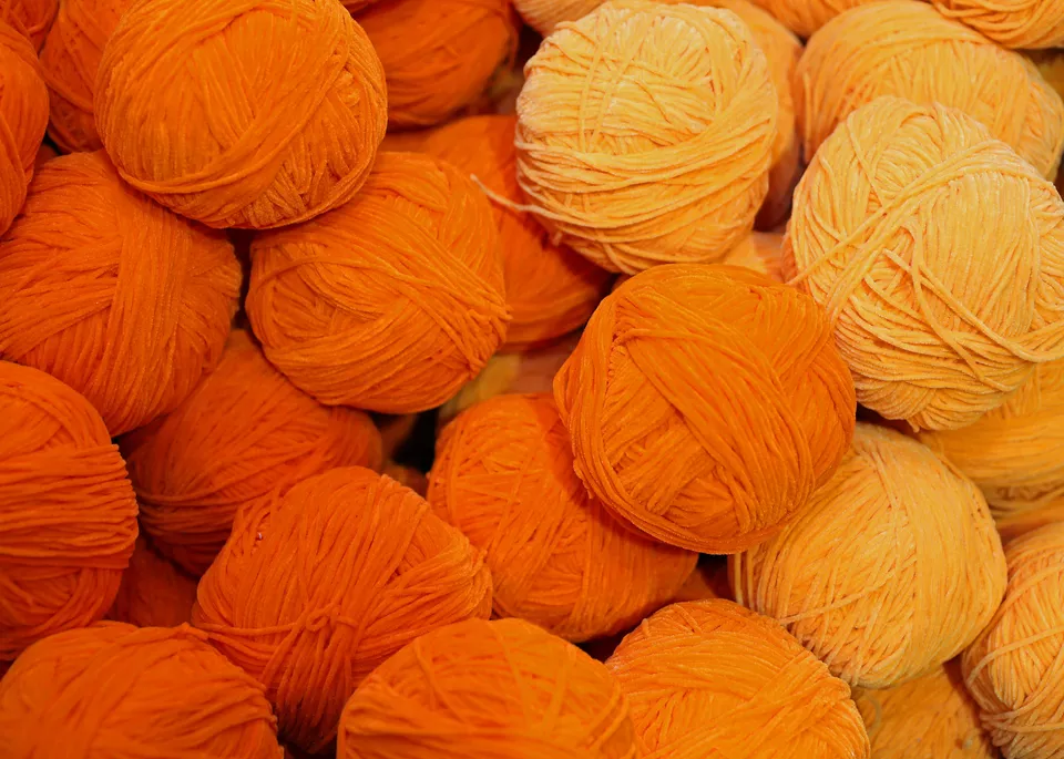 wool yarn colored with carrot juice dye
