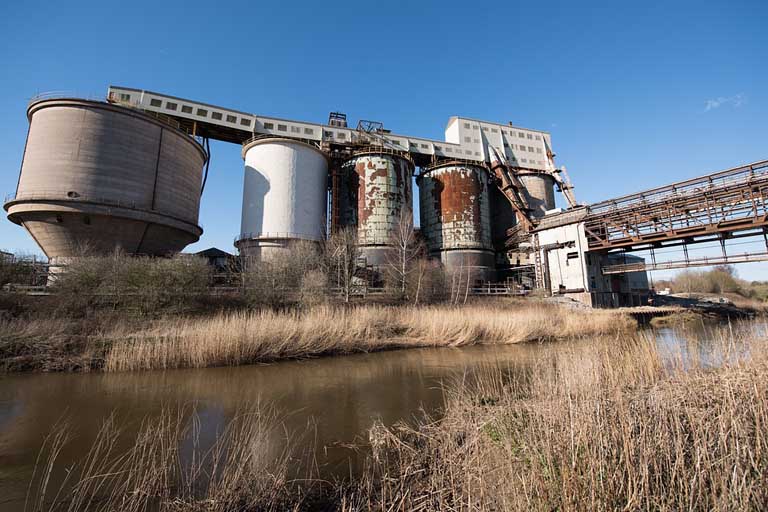 Photo of an old factory near a body of water