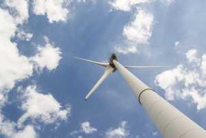 White windmill under cloudy sky